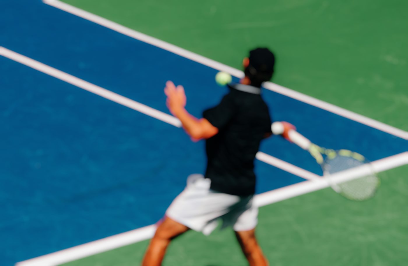 Tennis player striking a forehand