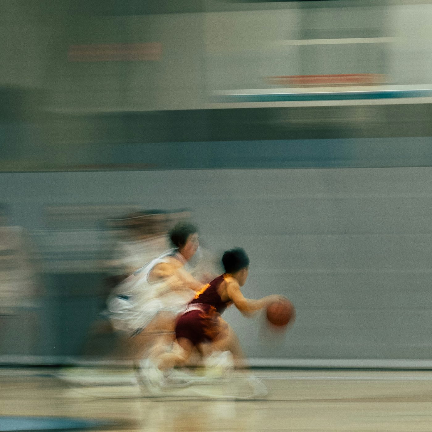 Basketball players driving to the basket